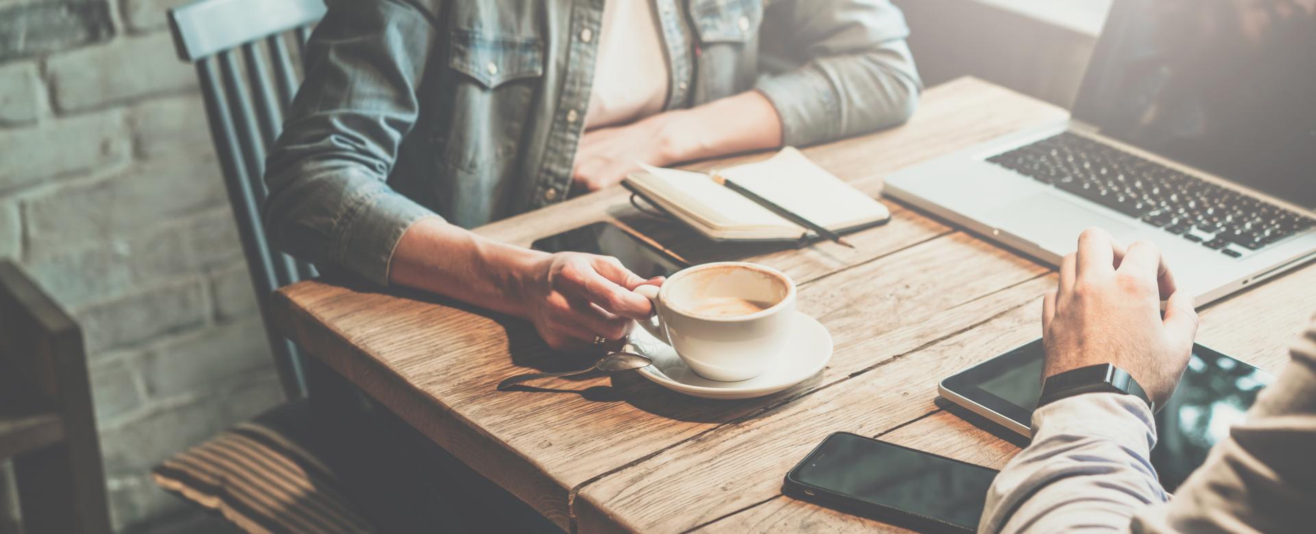 Two people having a meeting with coffee