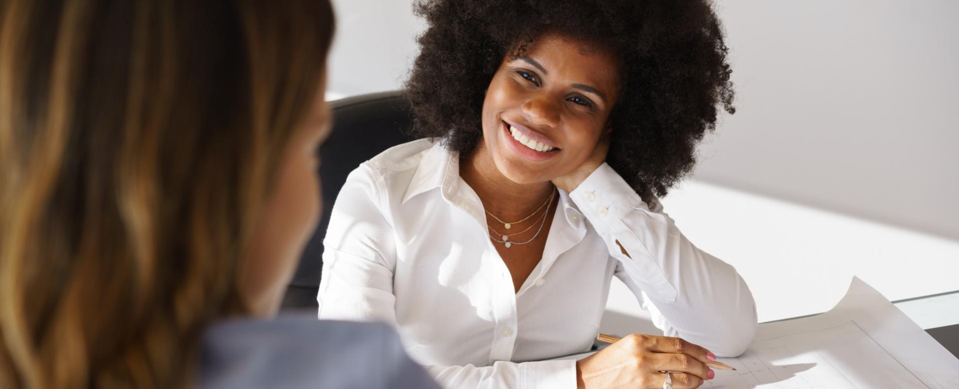 Girl smiling at desk