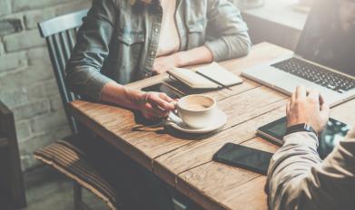 Two people having a meeting with coffee