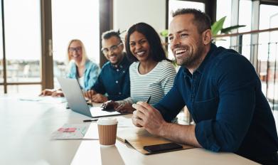 Men and Women Having Coffee at Board Room Table