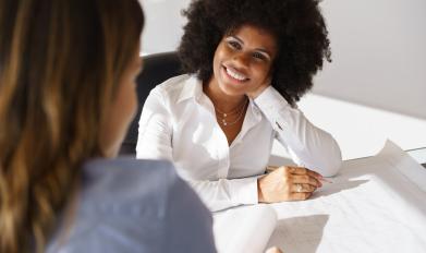 Girl smiling at desk