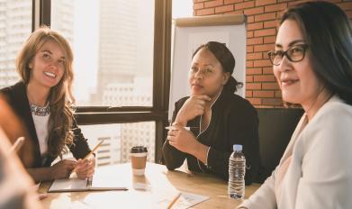 Women around a boardroom table