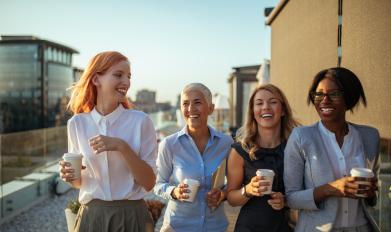 Female coworkers smiling