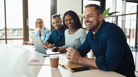 Men and Women Having Coffee at Board Room Table