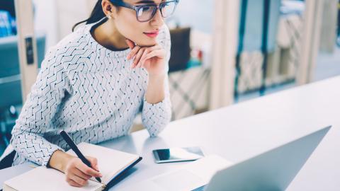 Woman writing in notebook